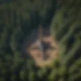 An aerial view of a pump site integrated within a lush forested area