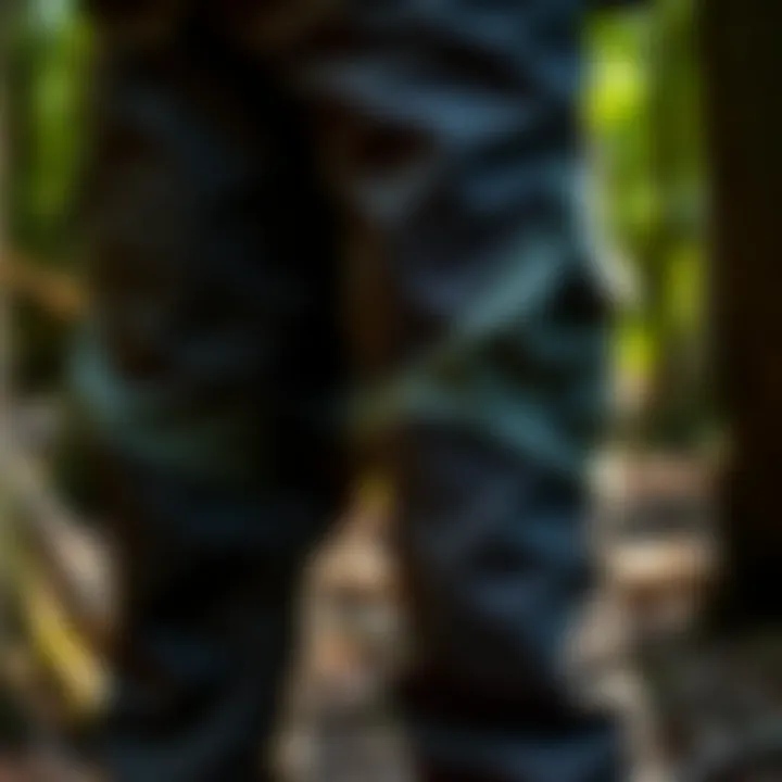 Close-up of protective chainsaw pants showcasing reinforced fabric for durability.