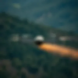 Aerial applicator in action over a forested area